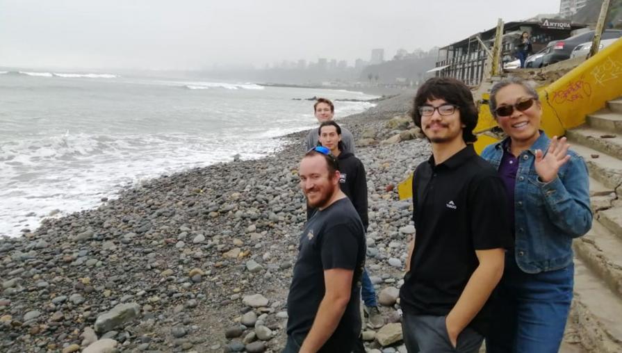 Students at Peruvian shoreline.
