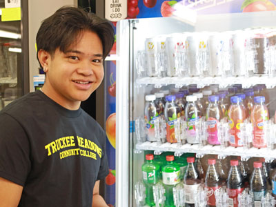 Person browsing a vending machine.