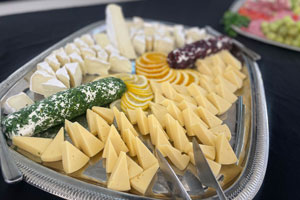 Cafe Verde catering cheese plate with Gouda, Brie, Chevre Cheese (herb lemon and Cranberry orange torchon)