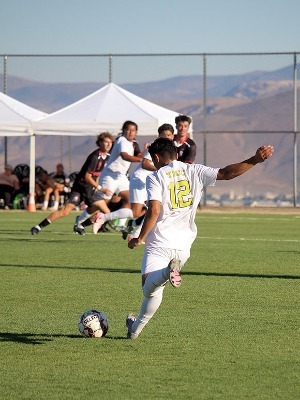 Mighty Lizard Fernando Robles moves to strike a pass to his teammate.