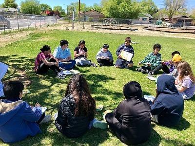 TMCC EDU students with Glenn Duncan Elementary School fifth graders facilitate Environment Liberation Education. Children write curiosity questions, do breathwork to observe nature with the senses and share their poems aloud.