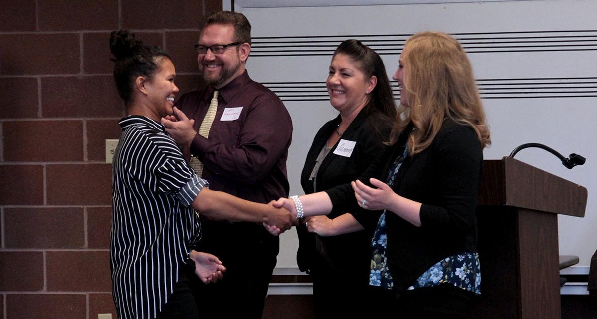 TMCC student accepting award.