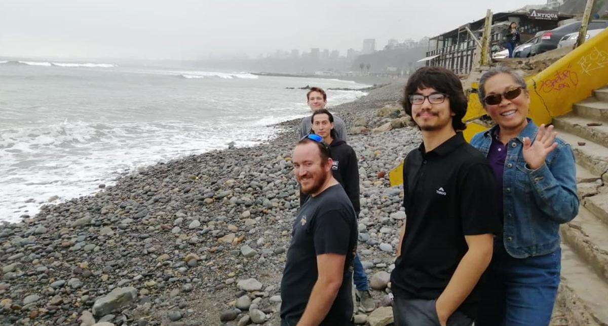 Students at Peruvian shoreline.