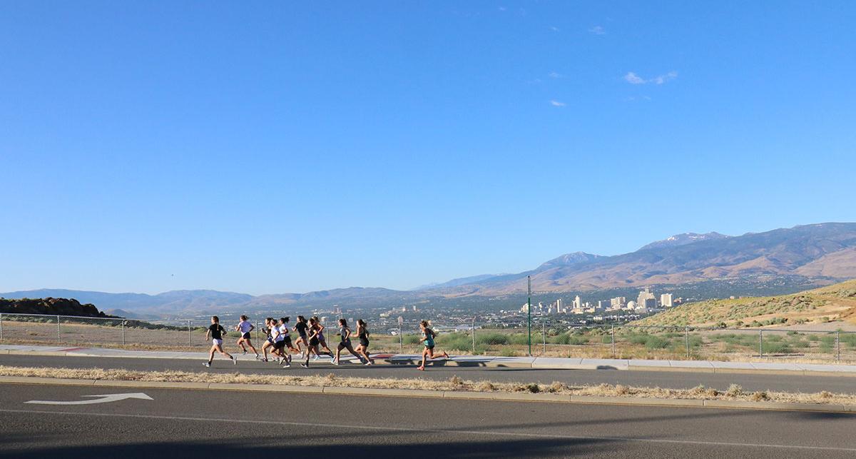 Athletes running up a hill.