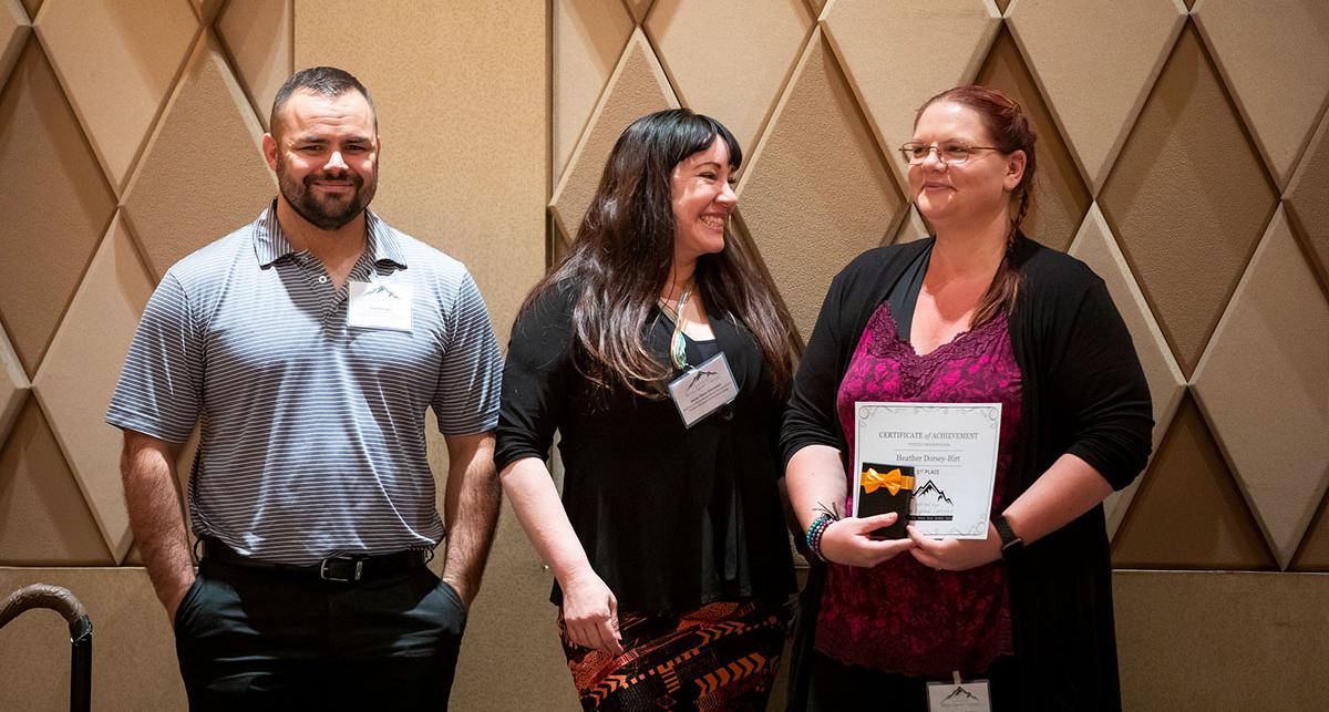 TMCC faculty accepting an award.