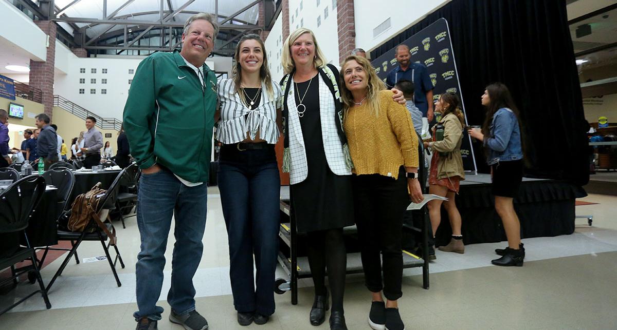 Samantha Lampe and her parents with Tina Ruff.