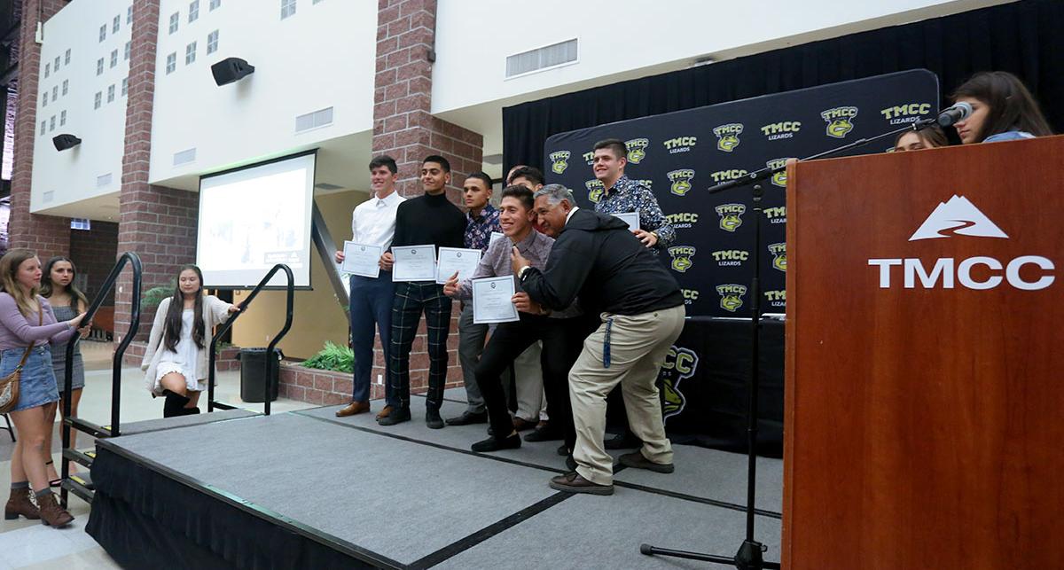 Members of the men’s soccer team with Coach Gonzalo Lopez.