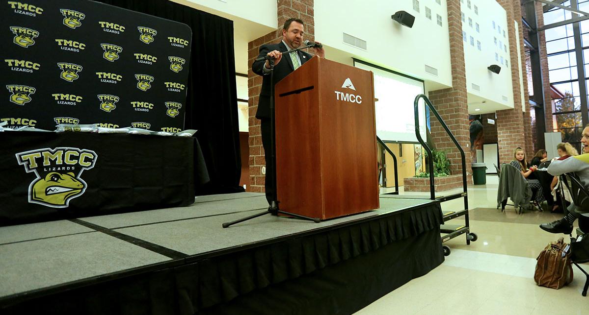 Vice Chancellor Nate Mackinnon at a podium.