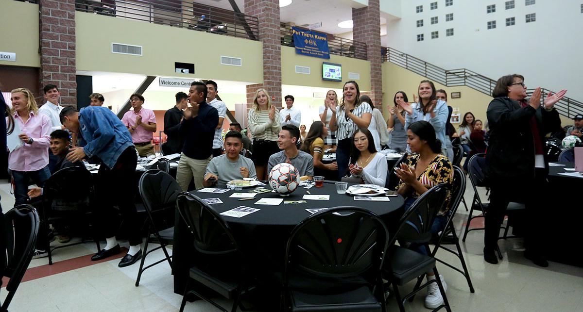 Student-athletes applauding.