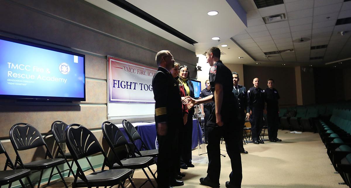 Cadet receives his certificate at graduation.