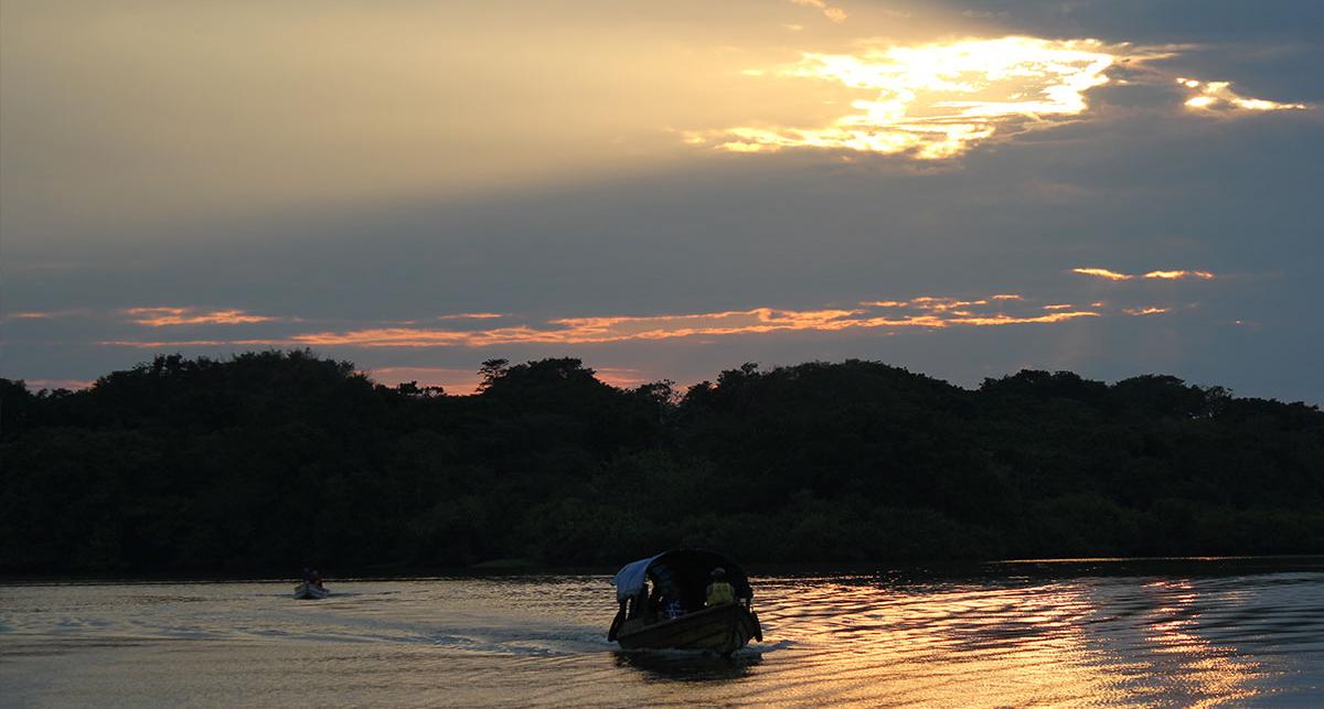 sunset with a boat in the foreground