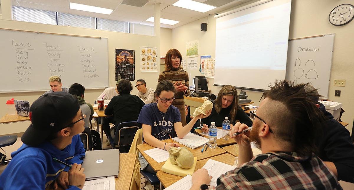 Namie working with students in a classroom