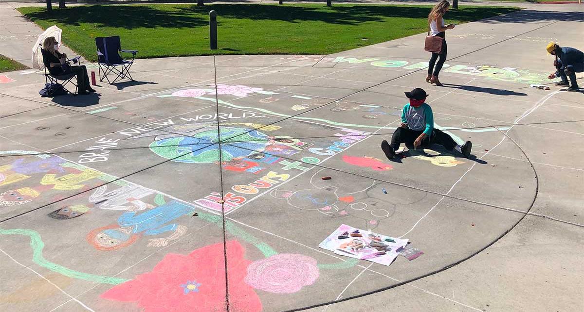 Students working on the chalk mural.