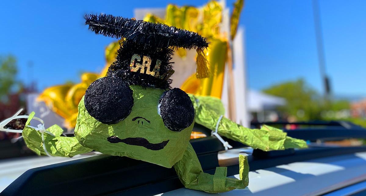 families decorated cars to celebrate graduates at drive through commencement