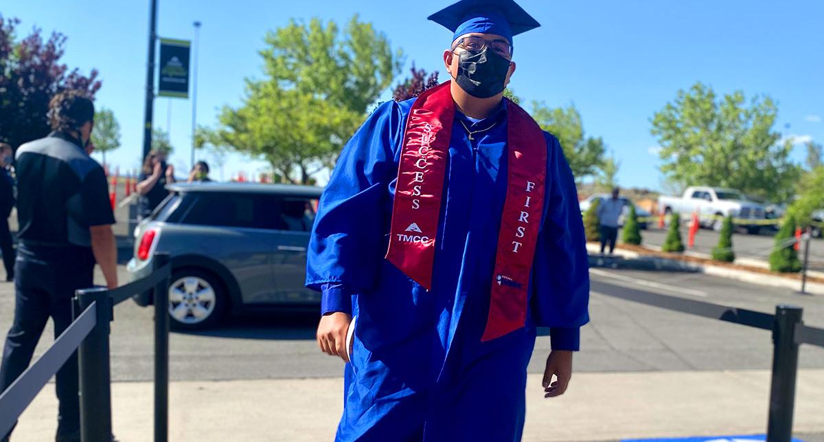 success first student at commencement in regalia