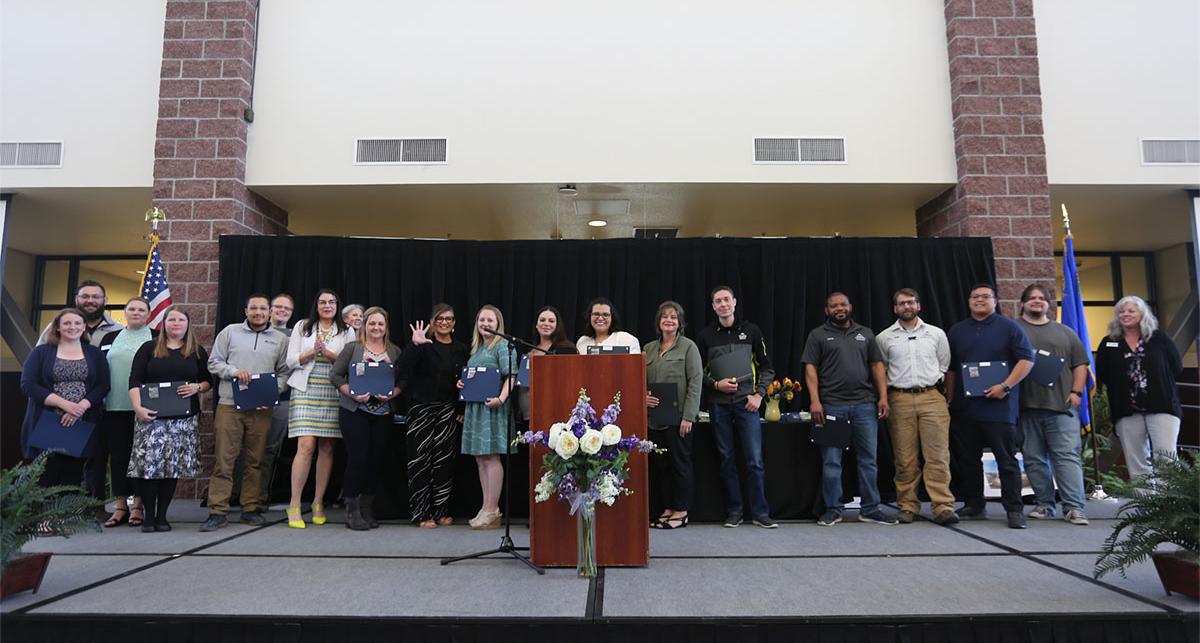 A large group of employees celebrate the fifth anniversary of their employment at TMCC.