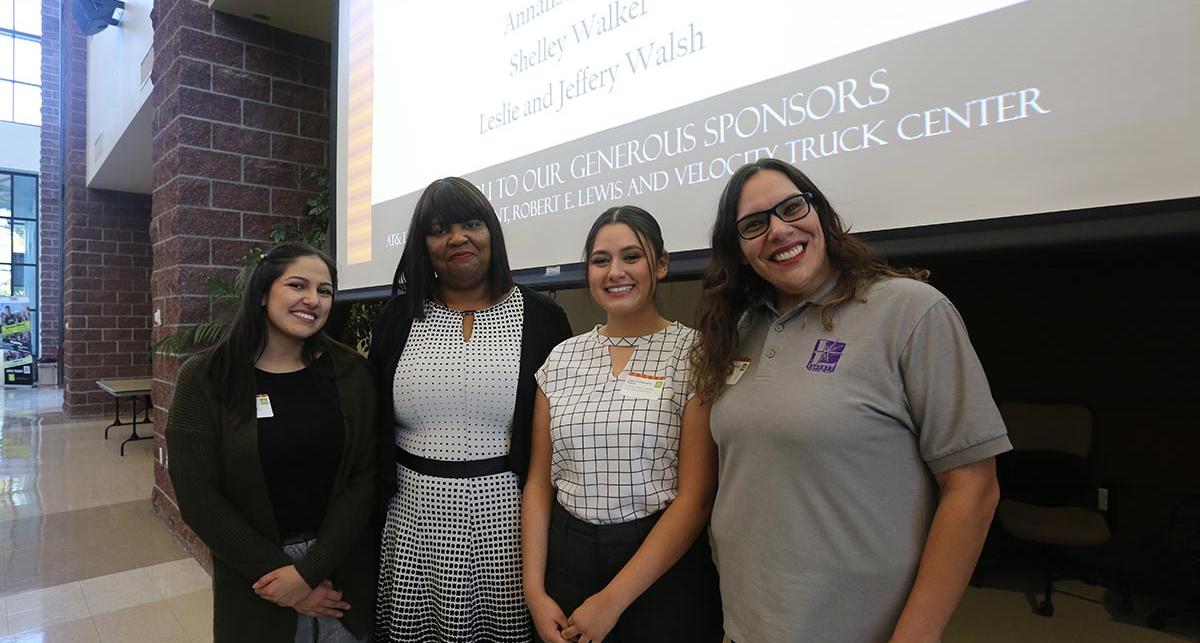 Members of Liberty Dental with scholarship recipients. 