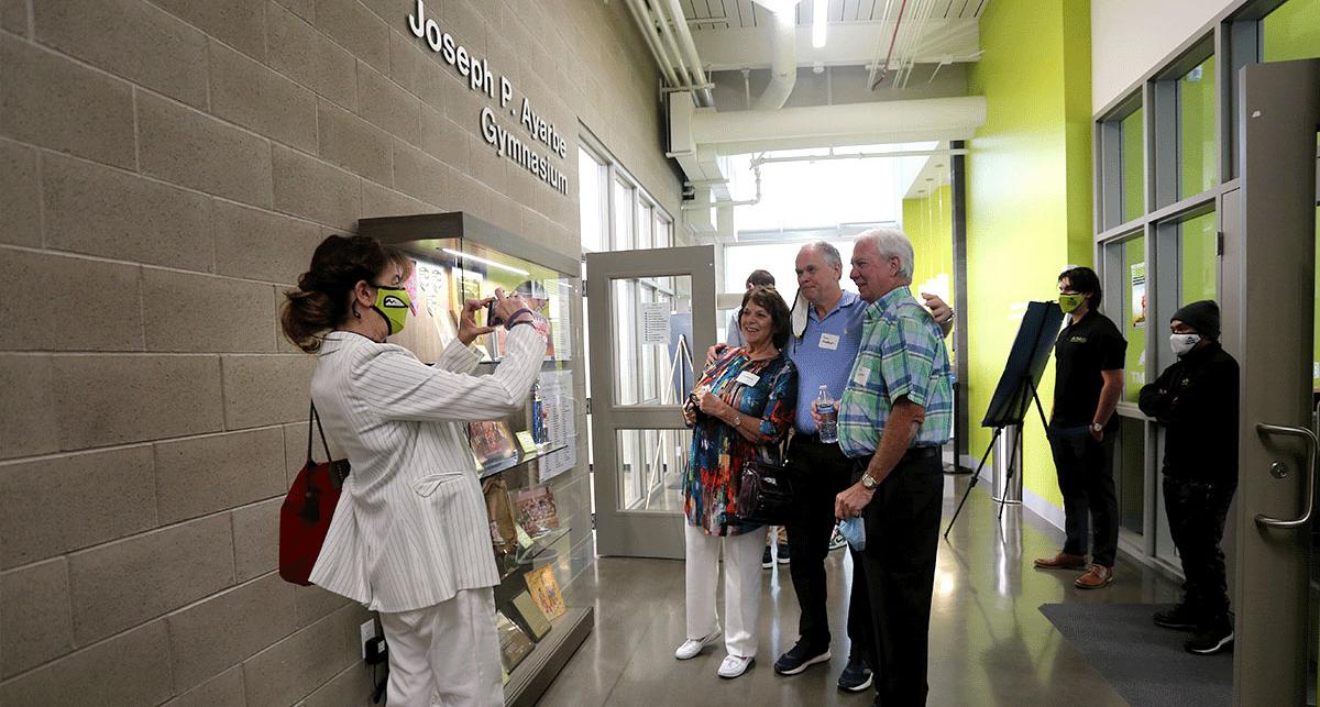 guests take pictures at ribbon cutting ceremony