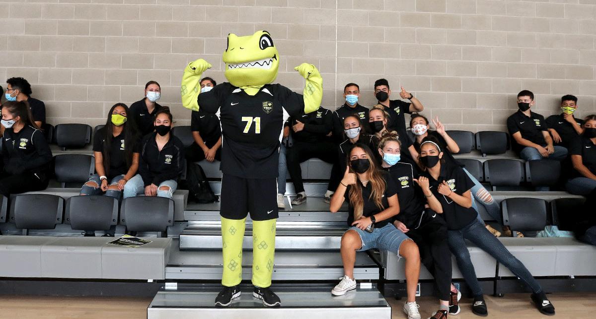 mighty, the athletics mascot, poses with tmcc student-athletes