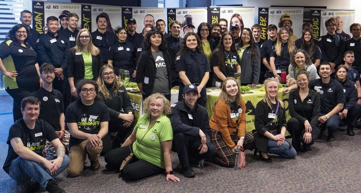 TMCC students, faculty and staff huddled together for a group photo inside the Nevada State Legislature building.