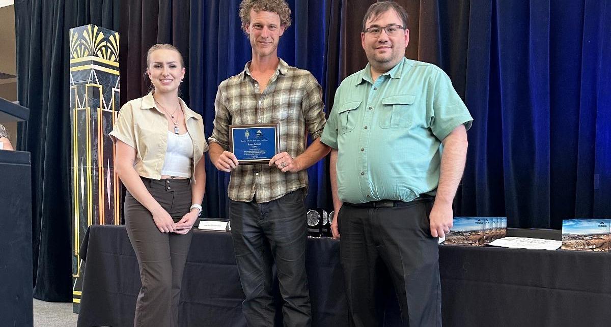 Stephanie Webbermissey and Joe Sanpietro present Roger Putnam with the 2023 Full-Time Teacher of the Year Award.