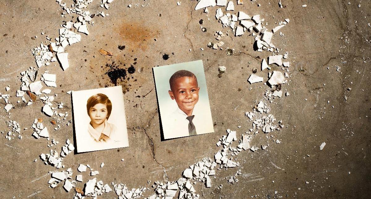 Two photos of young boys rest on the concrete, surrounded by shattered ceramic pieces. Origins, by Jordyn Owens.