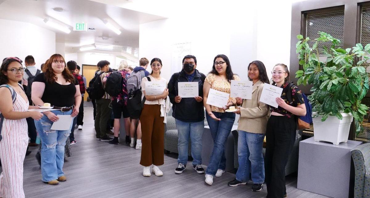 Students gather in the Sierra Building after the ceremony for a cake reception and to congratulate one another.