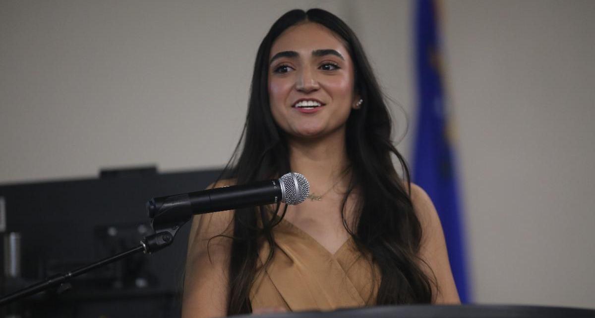 Evelyn Felipe addresses her fellow students and the audience with a lighthearted speech.