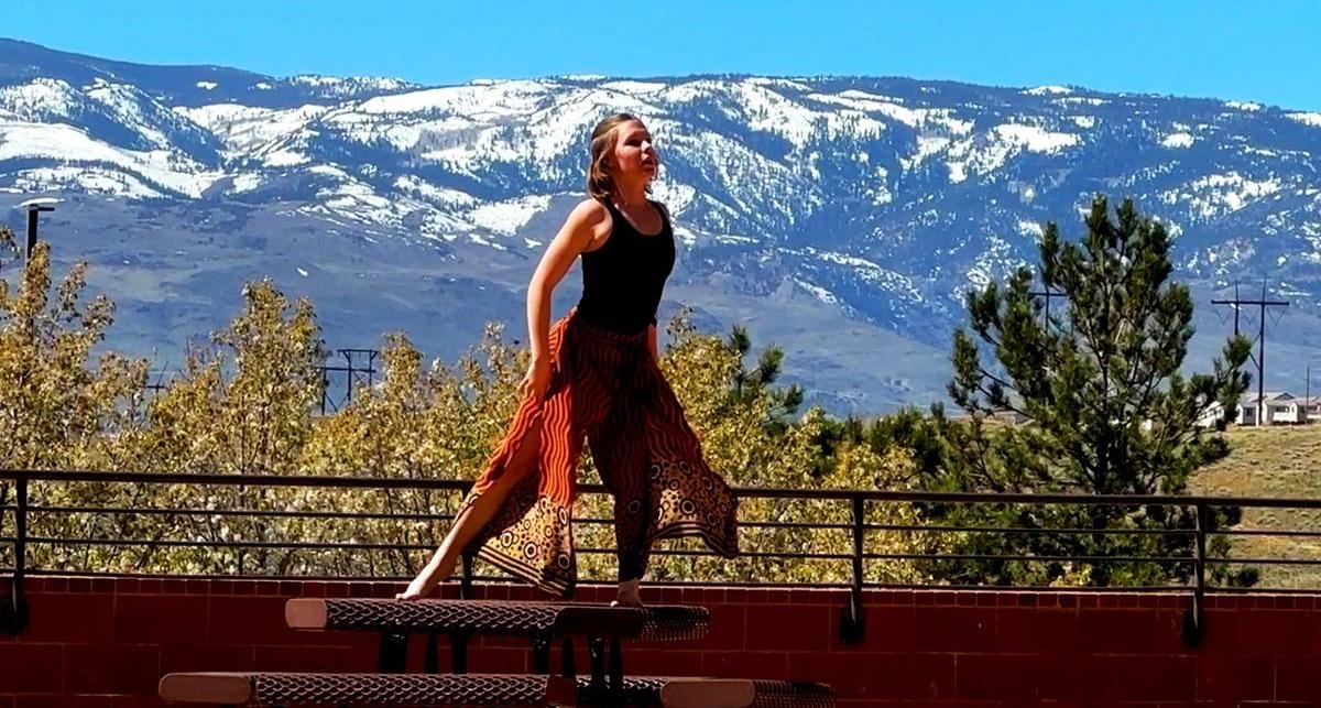 A student connects with the space she is in through alluring dancing.