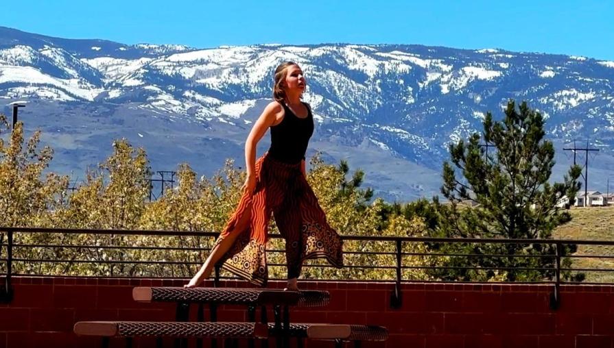 A student connects with the space she is in through alluring dancing.