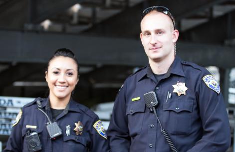 Two police officers standing next to each other