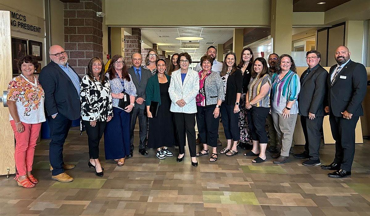 Senator Jacky Rosen poses with a group of TMCC staff and administrators on campus.