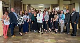 Senator Jacky Rosen poses with a group of TMCC staff and administrators on campus.