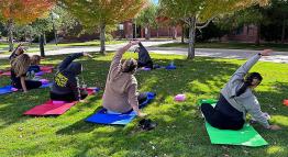 Students and staff strike a yoga pose while enjoying TMCC's outdoor plaza.